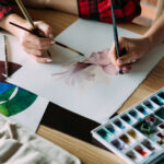 art school classes. painting courses. student and teacher drawing together. technique mastering and skills improvement.